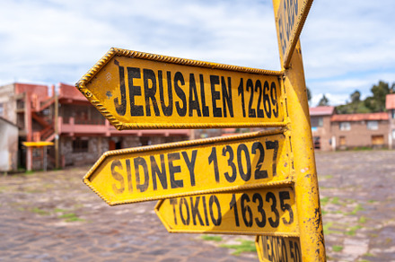 World capitals distance sign on Taquile Island, Lake Titicaca, P, a Photo by GoodGoods