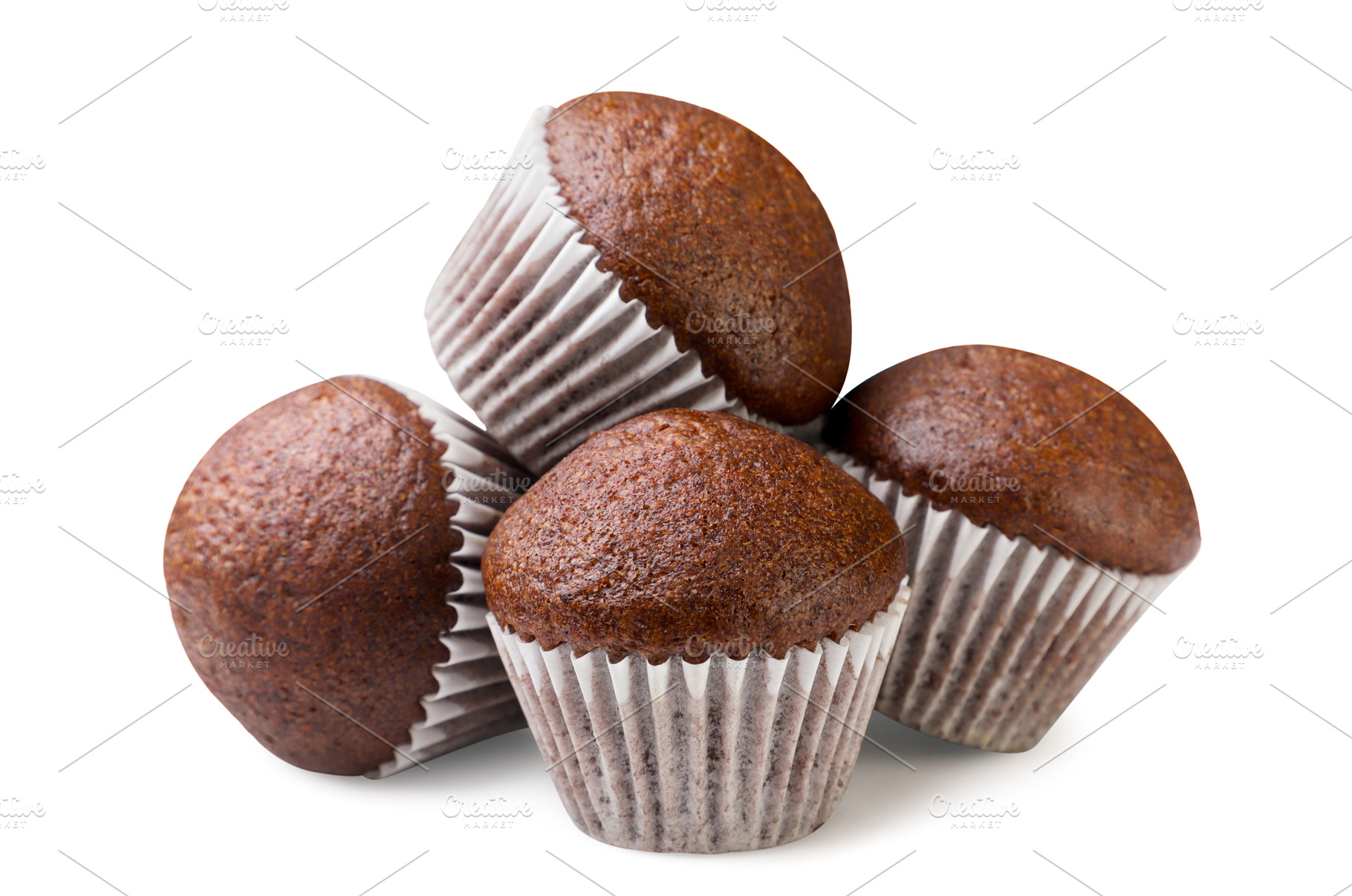 Pile of chocolate muffins close-up, a Food & Drink Photo by innakreativ
