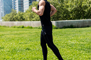 Male runner jogging in an urban park, a Person Photo by RF Images