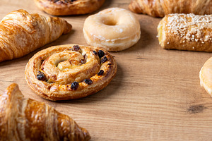 Assorted fresh pastries on wooden table, a Food & Drink Photo by etorres69