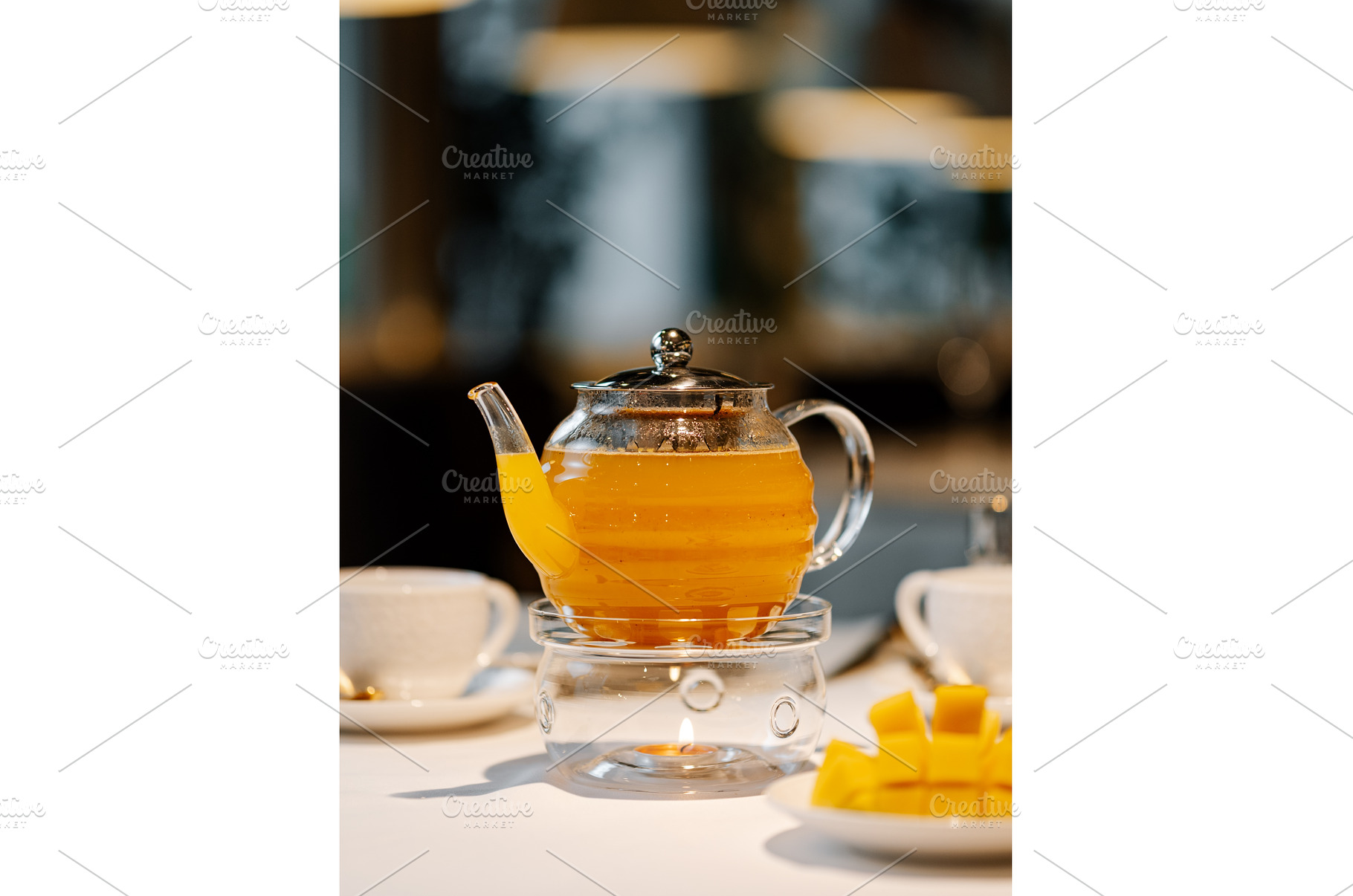 Mango herbal tea in teapot with, a Food & Drink Photo by Fascinadora