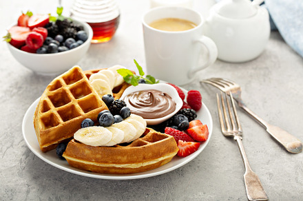 Waffles with berries and chocolate for breakfast, a Food & Drink Photo by farwasser