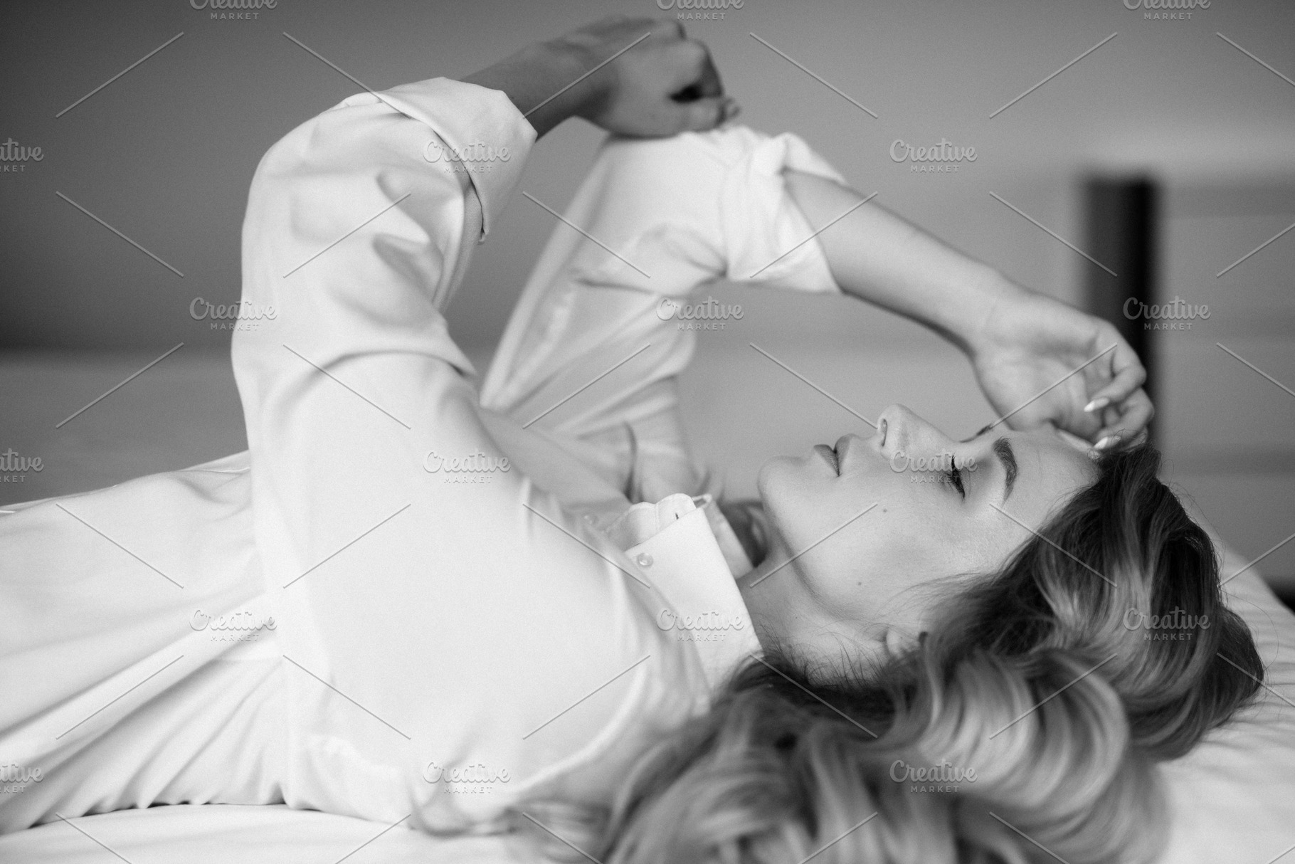 blonde bride in a tight wedding dress in a studio, a Person Photo by Weddings, People, Travel
