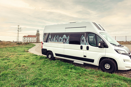 Camper van parked near to a lighthouse, a Transportation Photo by davidpereiras