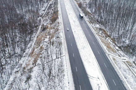Winter forest track aerial snowy road driveway, a Nature Photo by Photo Drive Studio