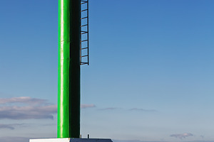 Green maritime beacon in a coastal p, an Industrial Photo by Perpis