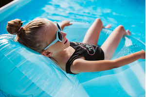 Girl lying on inflatable chair in, a Sports & Recreation Photo by HalfPoint