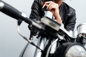 Biker woman in leather jacket on motorcycle containing girl, recast, and, a Person Photo by Aliaksei Kaponia