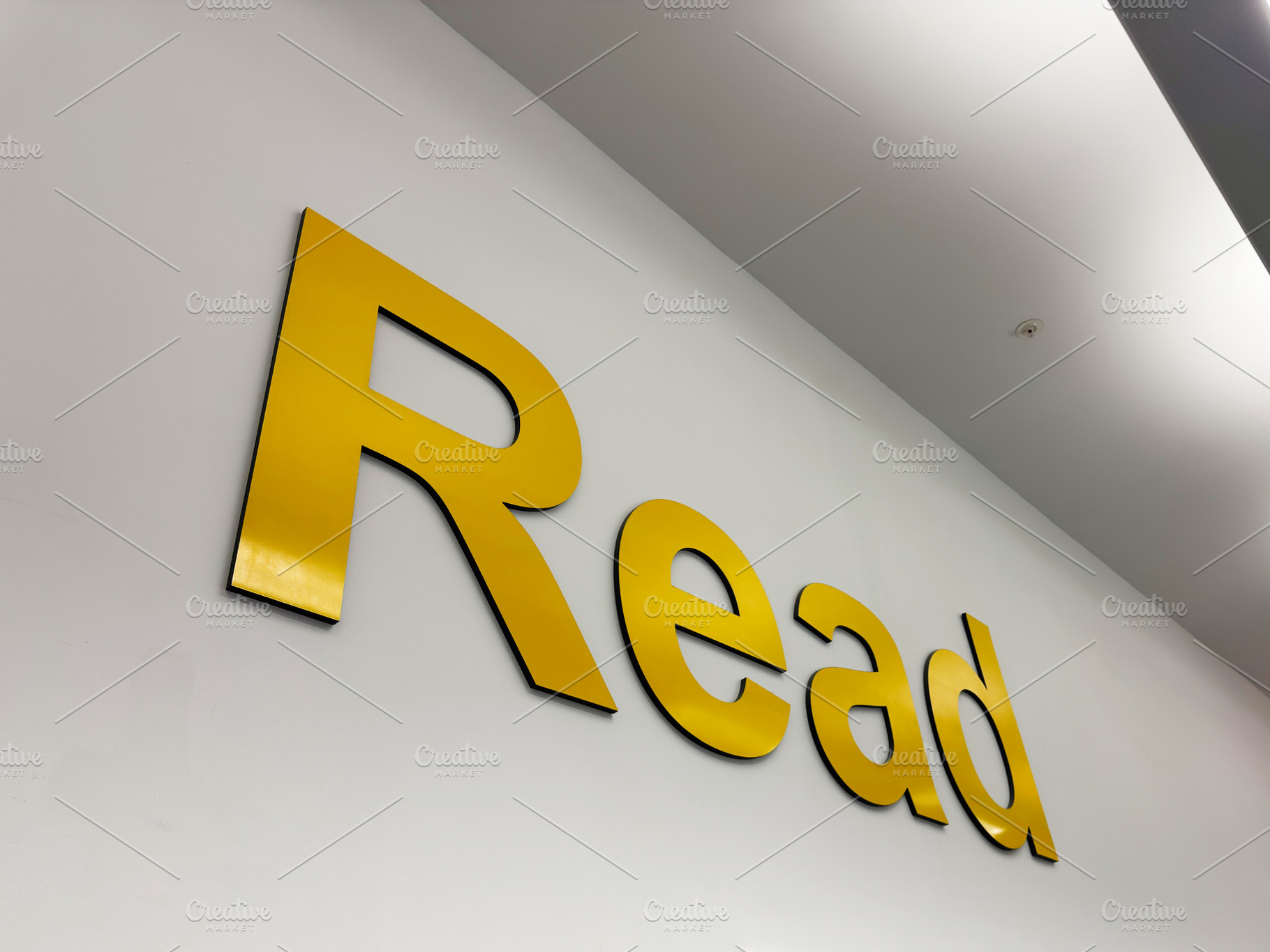 Read sign on a yellow wall in Liverpool, UK modern typography and interior sign, a Photo by AS photostudio