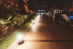 Night resort walkway with lights, an Architecture Photo by SkyNext
