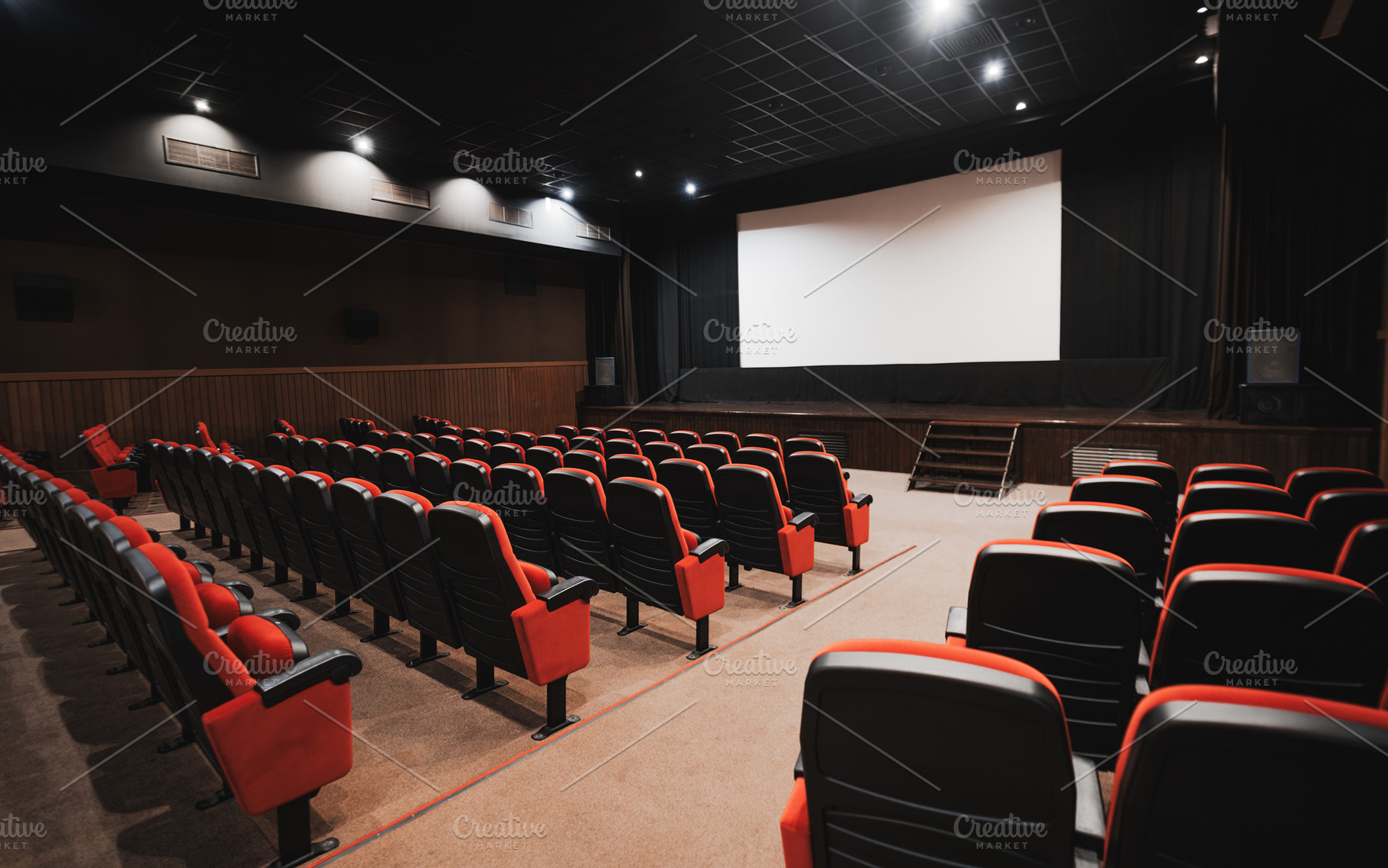 Empty cinema hall with blank screen, a Sports & Recreation Photo by SkyNext