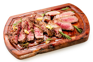 Sliced juicy medium rib eye steak, a Food & Drink Photo by Volff