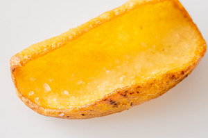 Single crispy potato dipper isolated, a Food & Drink Photo by Alexander Prokopenko