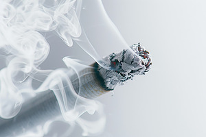 Burning smoking cigarette, a Photo by AlyaAnd