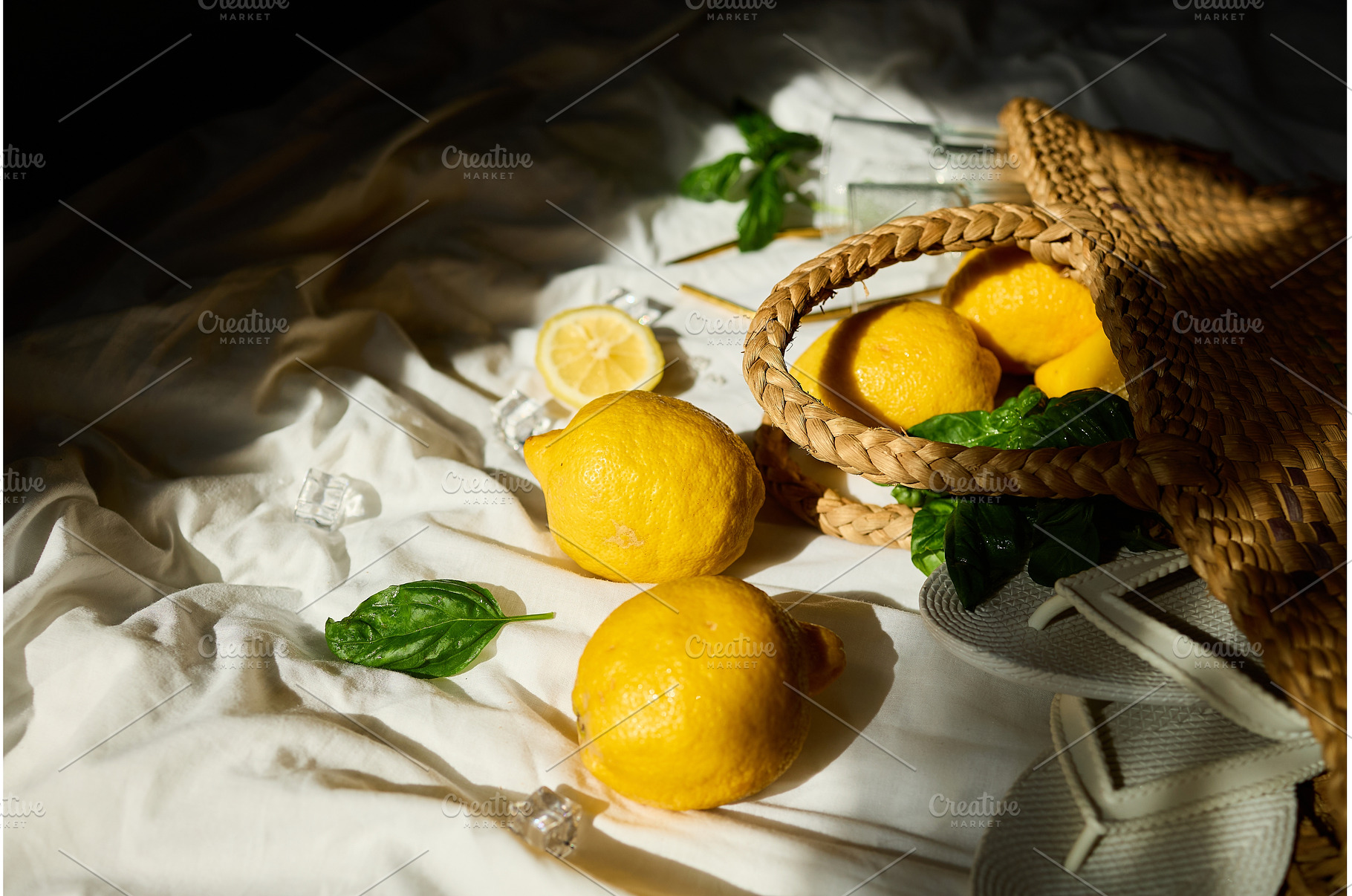 Bright summer lemons in a woven bag, a Food & Drink Photo by IlliaBondarPhotography