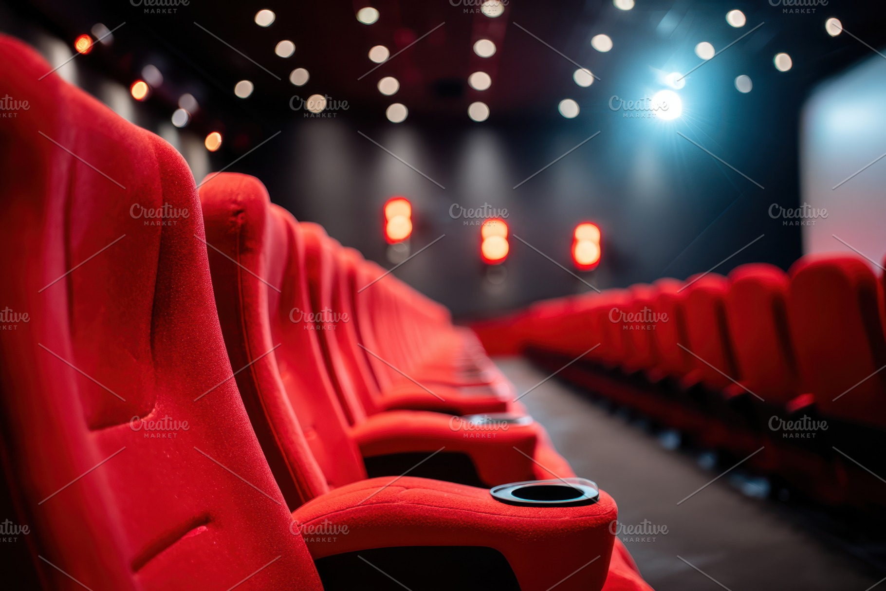 Modern red reclining seats with cup holders, an Arts & Entertainment Photo by AlyaAnd