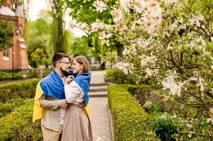 Happy couple hugging flag Ukraine