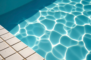 Abstract background of sunlit pool, a Photo by rarrarorro