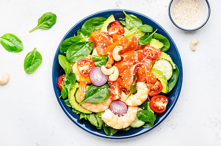 Ketogenic diet salad with salmon, shrimp, avocado, spinach, cucu, a Food & Drink Photo by 5PH