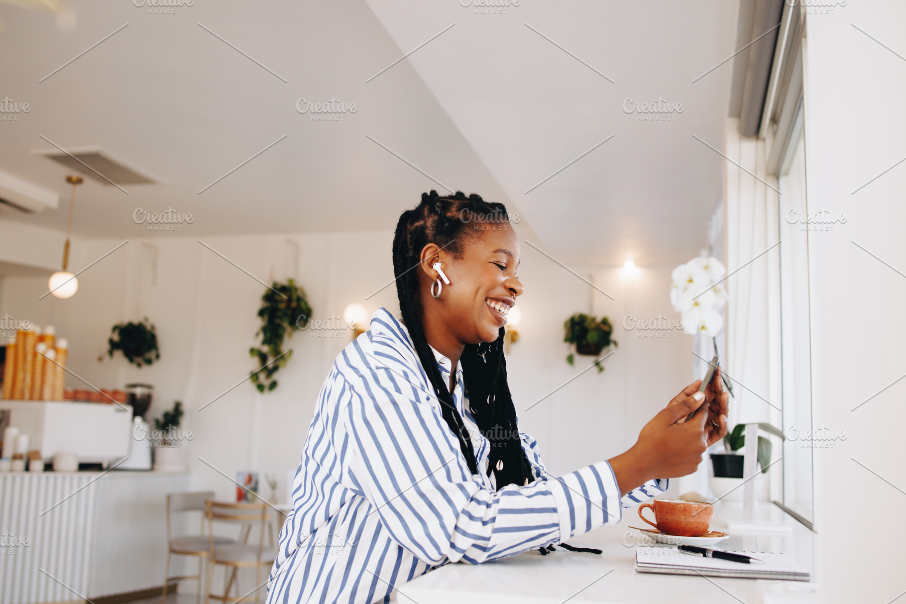 Cheerful young businesswoman having a video call on a smartphone, a Person Photo by Jacob Lund