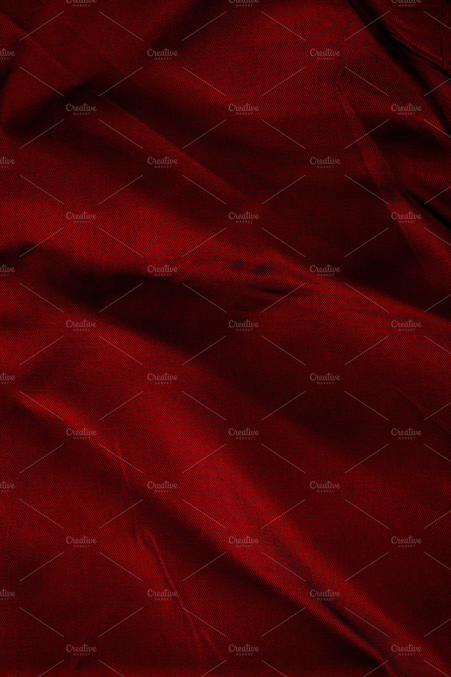 Close-up of soft, rich red fabric with gentle folds and subtle s, a Background Photo by Ales Munt
