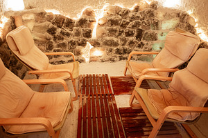 Comfortable lounge chairs inside a serene salt therapy relaxation room, a Photo by AS photostudio