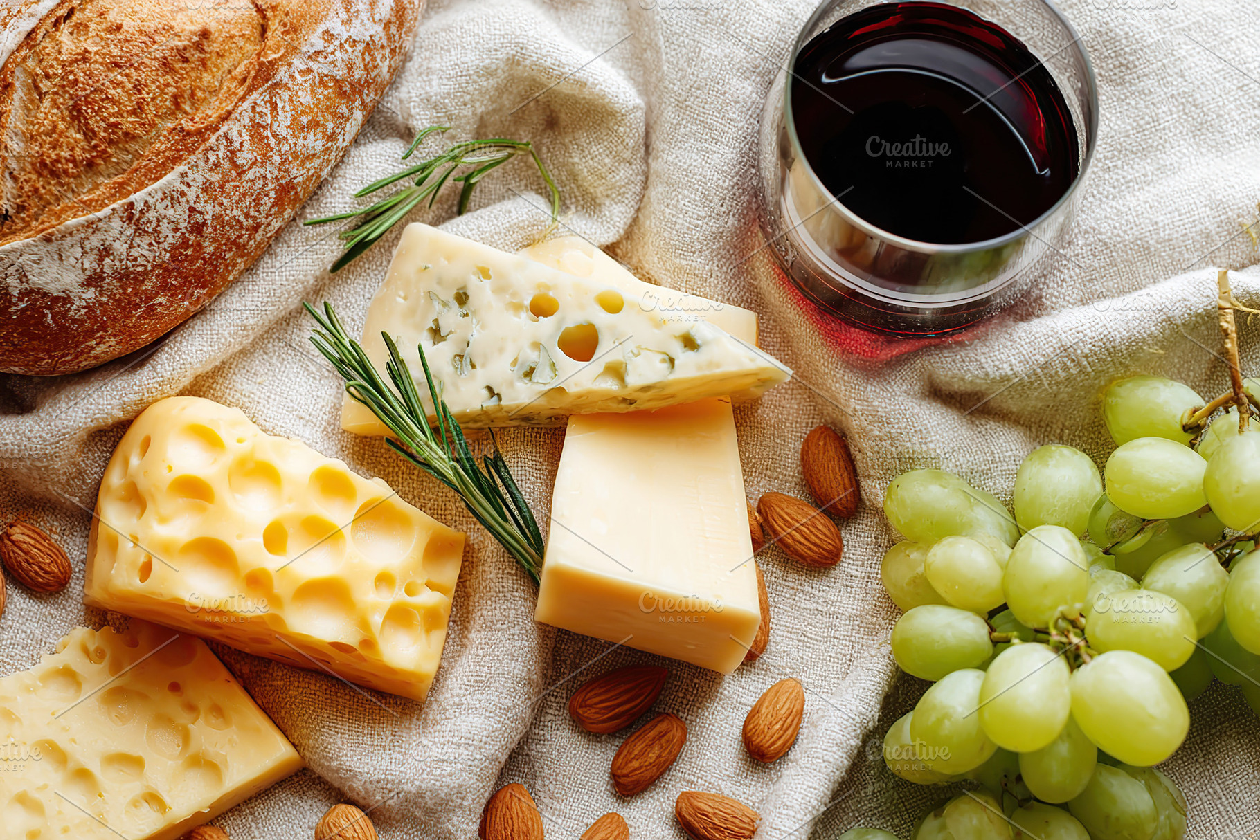 Delightful cheese platter featuring soft and hard cheeses with accompaniments, a Food & Drink Photo by AlyaAnd