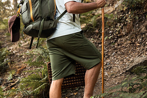Hiker climbing a steep slope with a, a Person Photo by Perpis