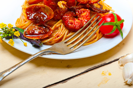 Italian seafood spaghetti pasta on red tomato sauce, a Food & Drink Photo by keko64