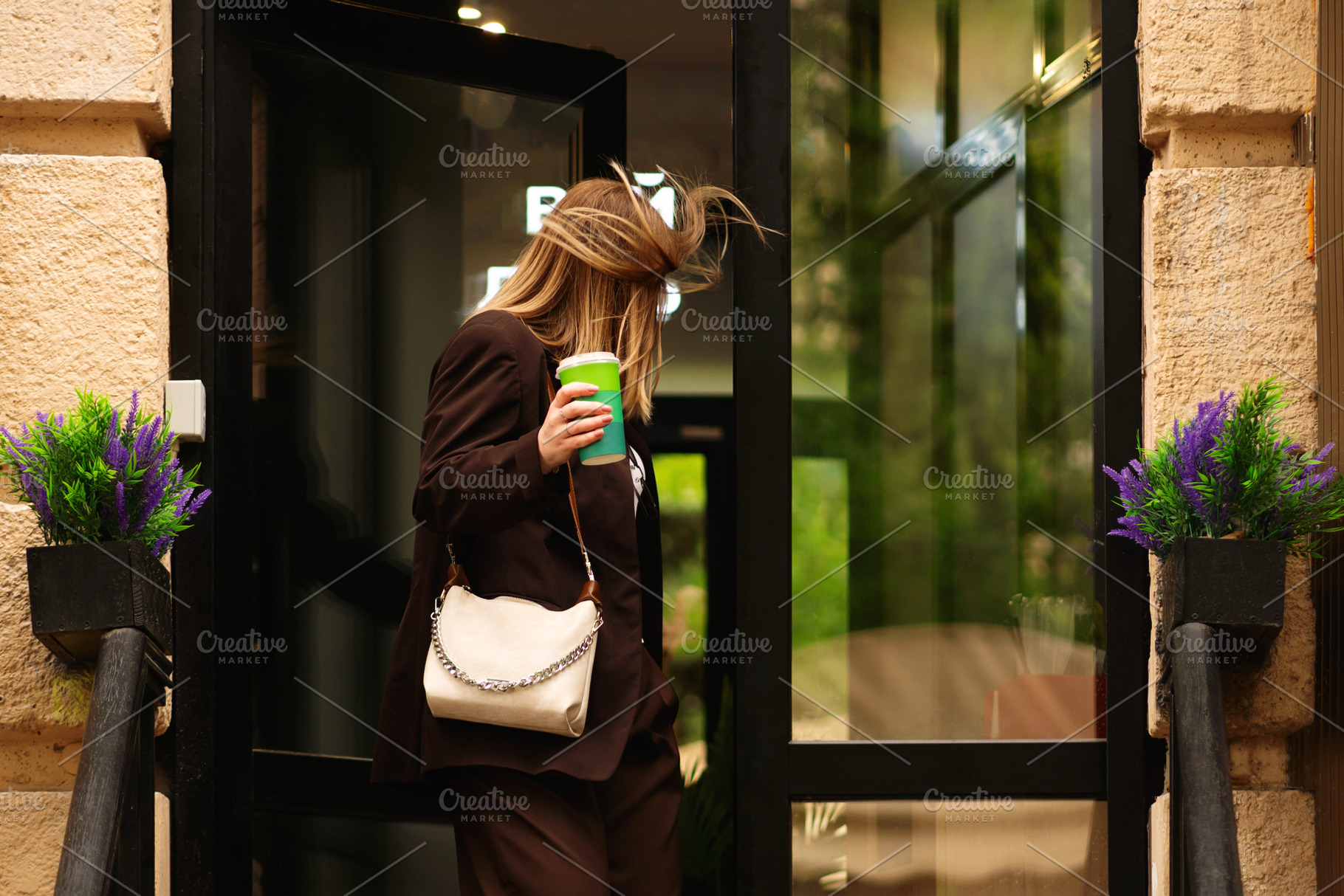 Blonde woman holding coffee cup walk, a Person Photo by Elena Vagengeim