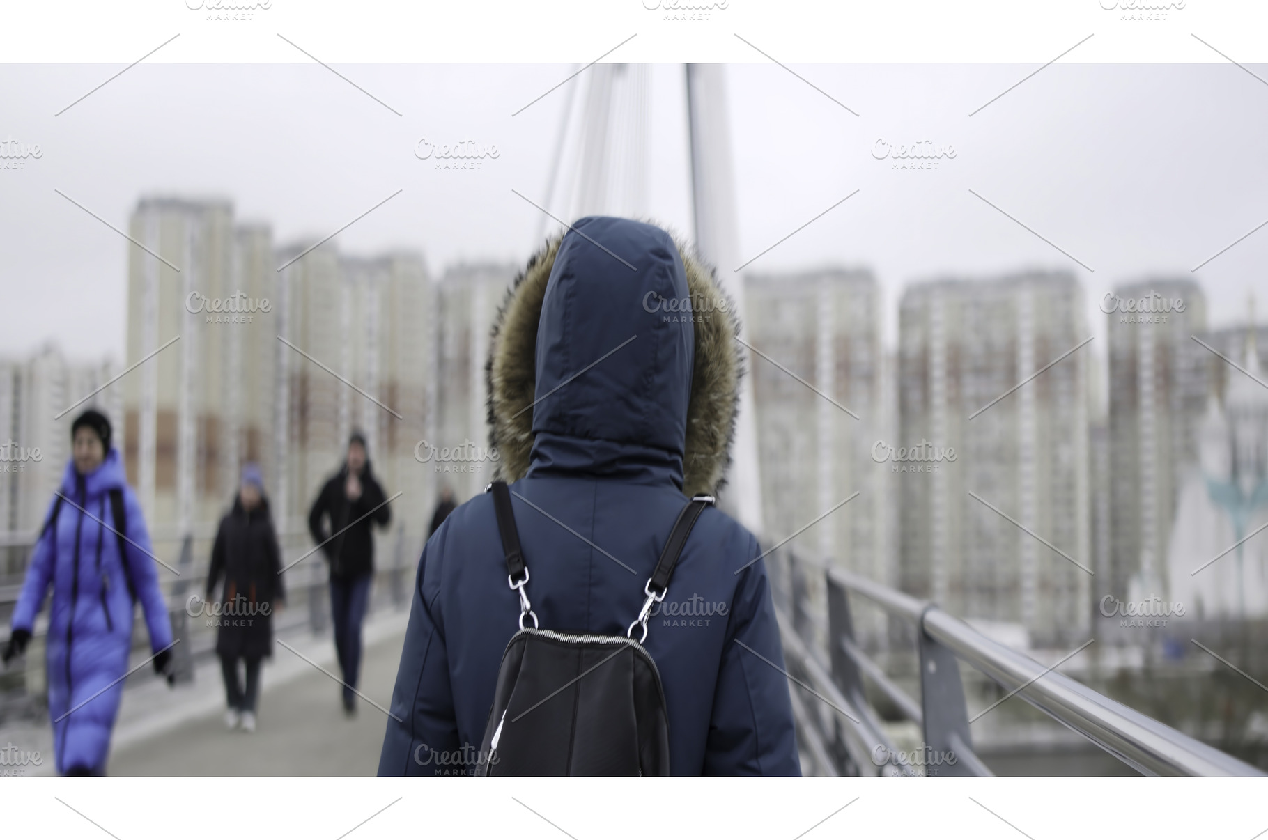 Woman walking on bridge as people, an Architecture Photo by Media Whale Stock