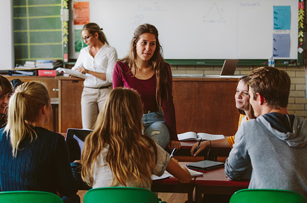 Friends study together in class room, a School & Education Photo by Jacob Lund