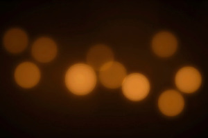 Golden Bokeh Lights on Dark Backgrou, a Photo by LOGOCREATIVE