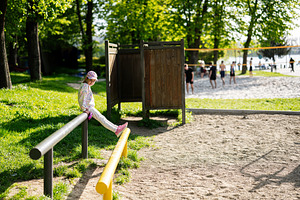 Child enjoying a sunny day at the park playground outdoors, a Person Photo by AS photostudio