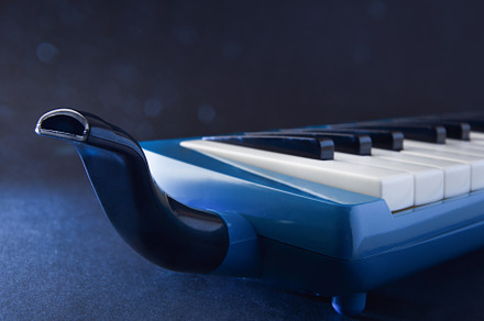 Melodica with mouthpiece to play directly with dark bluish backg, an Arts & Entertainment Photo by Davizro's Market