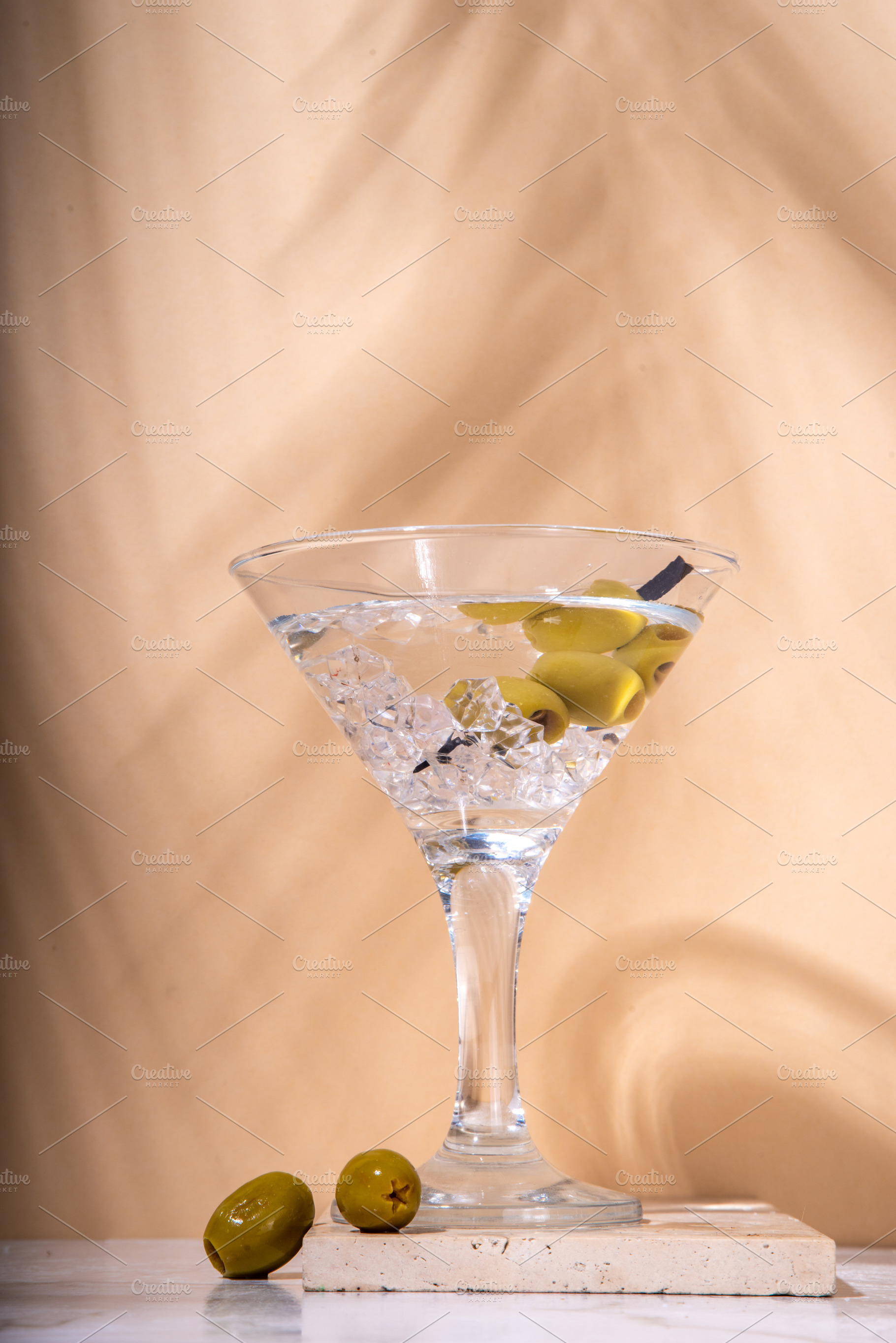 Classic martini cocktail with olive, a Food & Drink Photo by Rimma