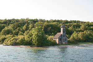 Old lighthouse featuring water, michigan, and lighthouse