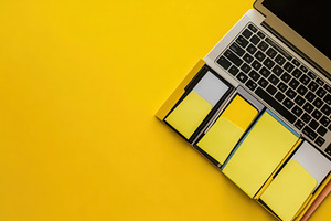 Laptop computer with sticky notes, a Photo by Pavel_design