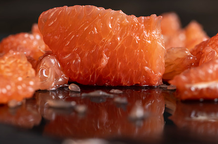 slices of peeled grapefruit close-up, a Photo by MyPhotos
