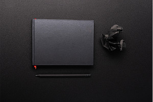 Black notebook with red bookmark, a Background Photo by Stockphoto by vzwer