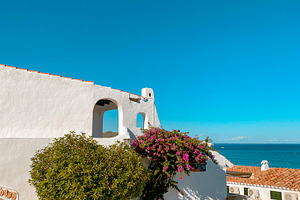 white houses by the sea in La Almadrava, Spain, a Photo by Nito