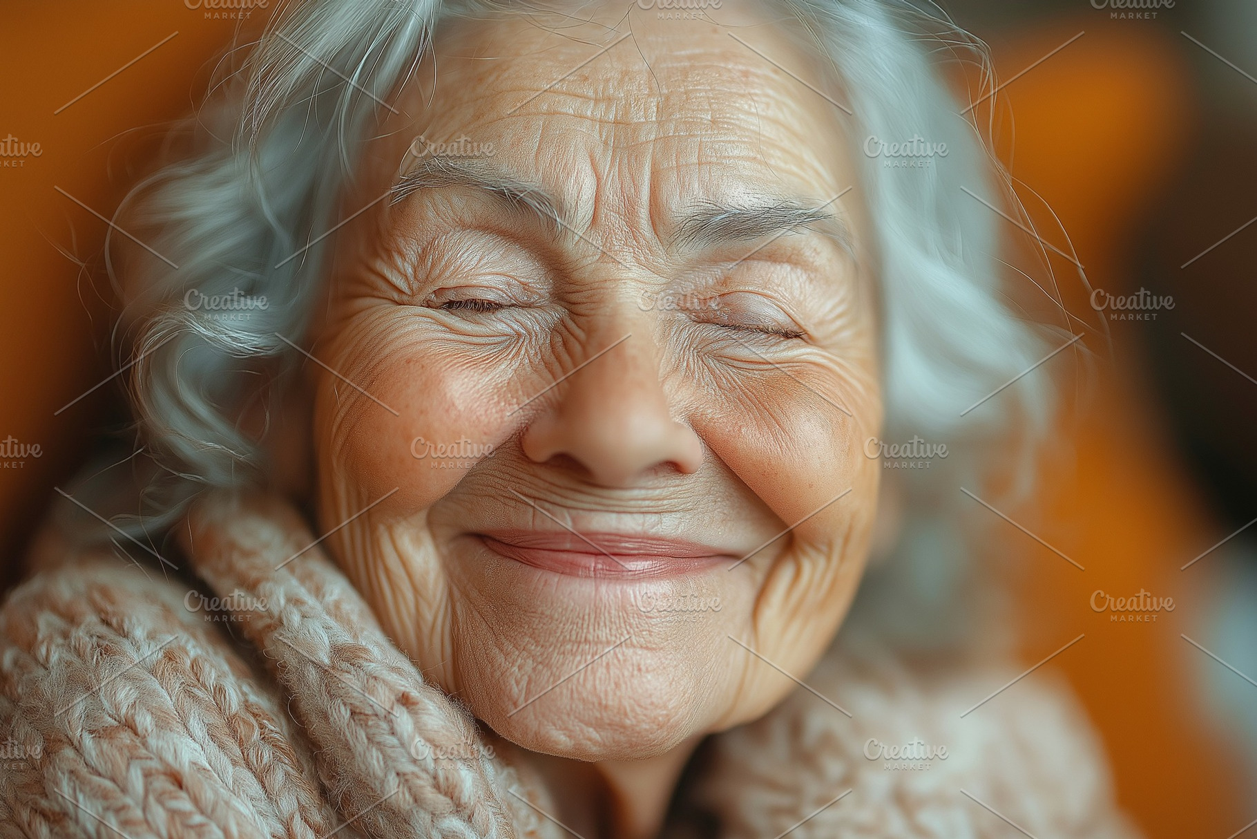 A joyful elderly woman with silver hair smiles warmly, wrapped in a cozy, knitt, a Background Photo by ImageMir