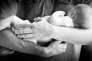Father Holding Newborn Baby Boy Black and White, a Person Photo by THP Creative
