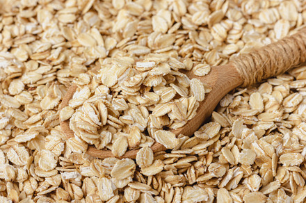 Oat flakes with wooden spoon, a Food & Drink Photo by Dina Belashova