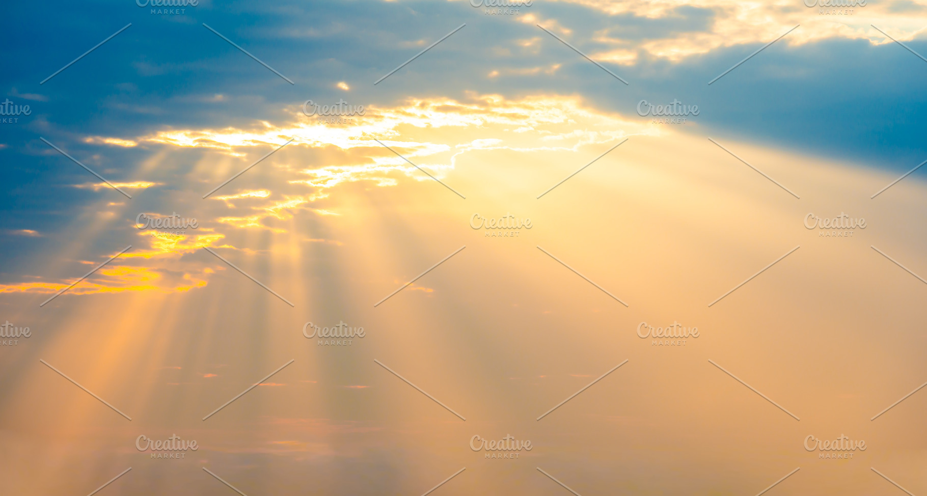 Sunset sky panorama with sun rays through clouds, a Nature Photo by Vapi