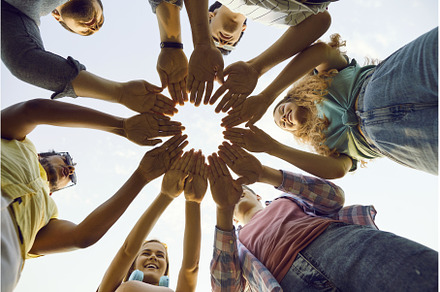 Group of friends stand outdoors, a Person Photo by StudioRomantic
