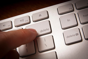 Finger Pressing Delete Key, a Technology Photo by THP Creative