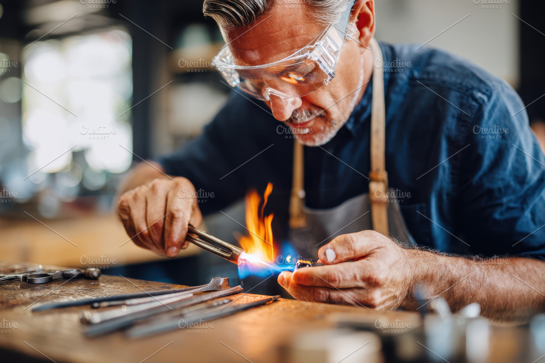Craftsman Using Blowtorch in Workshop, a Person Photo by AlyaAnd