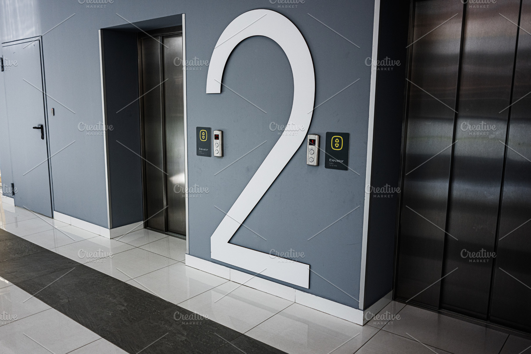 Modern elevator lobby with level two number displayed on a clean wall, a Photo by AS photostudio
