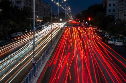 Blurred car traffic light at night city. Traffic jam in evening, a Transportation Photo by Eugene_Photo